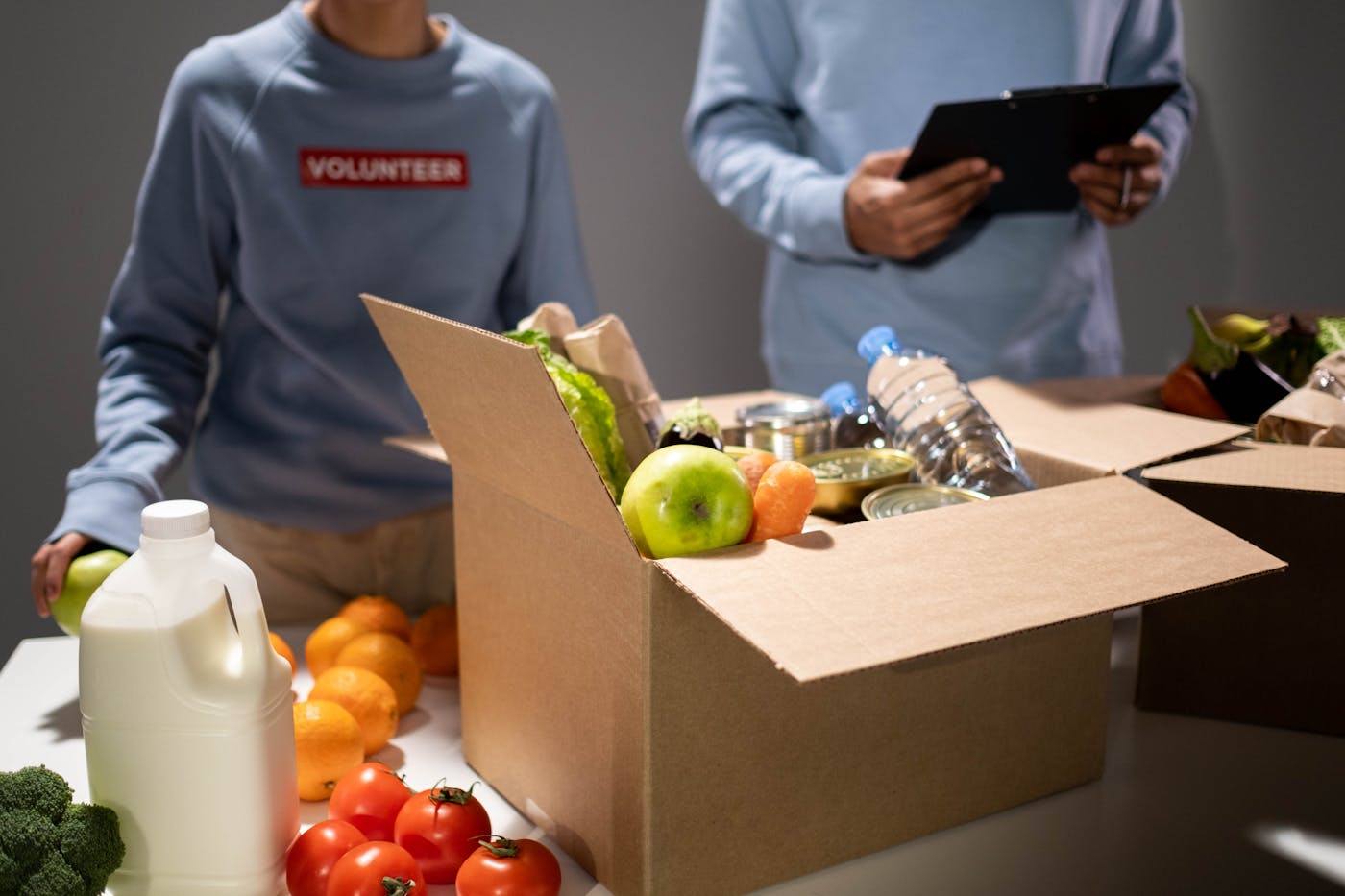 Food staples and drinks packed for distribution — illustrating nutrition support and food security logistics.